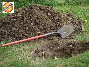A shovel next to a pile of Dirt ready to be loaded into a Micro Dumpster 3.5-yard Dirt dumpster