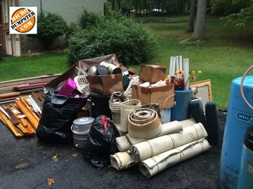 A stack of household junk and common trash in bags, ready to be loaded and hauled away in Glenview