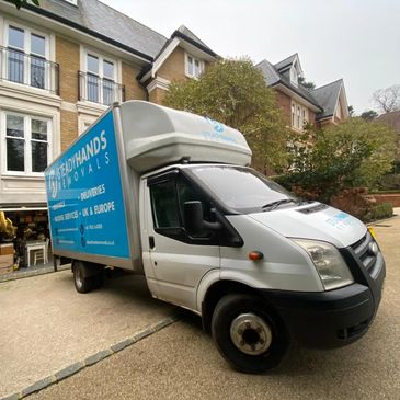 Removal van parked outside a house