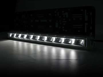A bright LED light bar illuminating a dark surface.