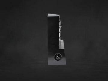 Side view of a black arcade cabinet against a dark background.