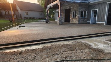 Large exposed aggregate pads for house & shop
