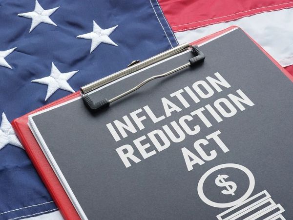 Clipboard with Inflation Reduction Act text on an American flag.