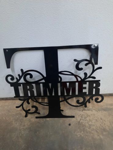 Decorative metal sign with the word 'TRIMMER' and the letter 'T'.