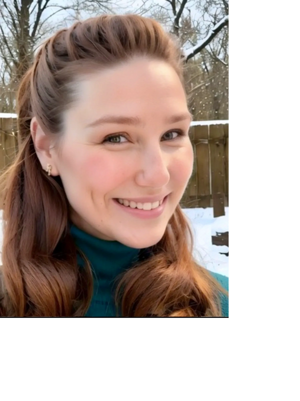 Portrait of nurse practitioner Jennifer Seegars a young woman, smiling, with red wavy shoulder lengt