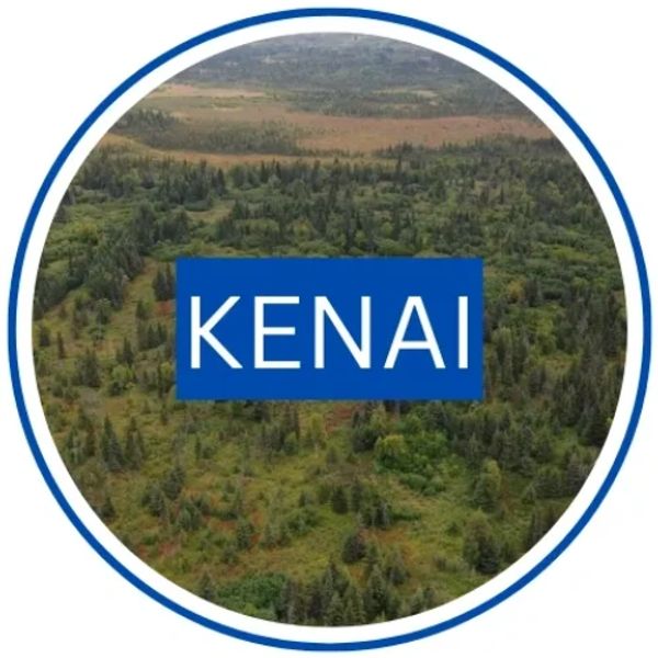 Circular Kenai graphic showing an aerial view of forest and open land with a blue Kenai label.