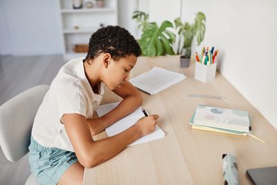 Boy doing homework at a desk