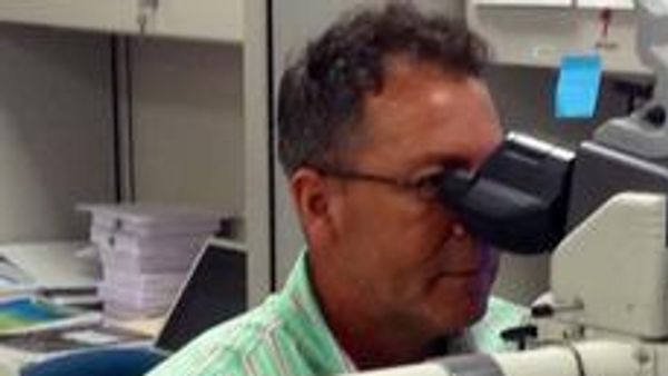 Ophthalmologist performing an eye exam on a senior patient for vision health
