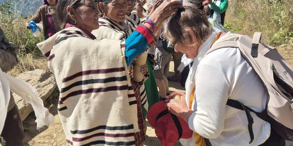 Receiving blessings from local women