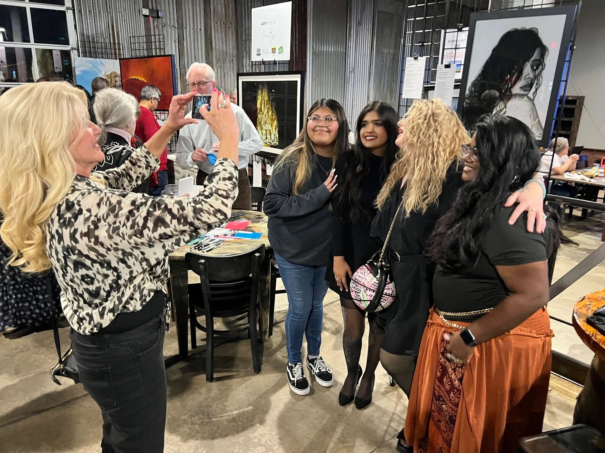 Group of smiling women at an Art Club of McKinney event take a picture together.