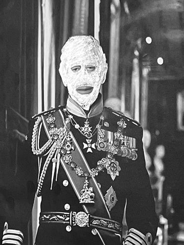 King Charles lll decorated military uniform with graphite black mask.