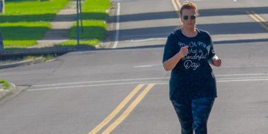 A woman jogging on a sunny street with the text 'Deedlee's Journey'.