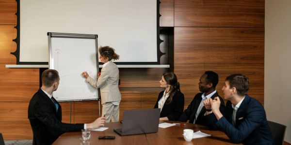 Business presentation with a group in a meeting room.