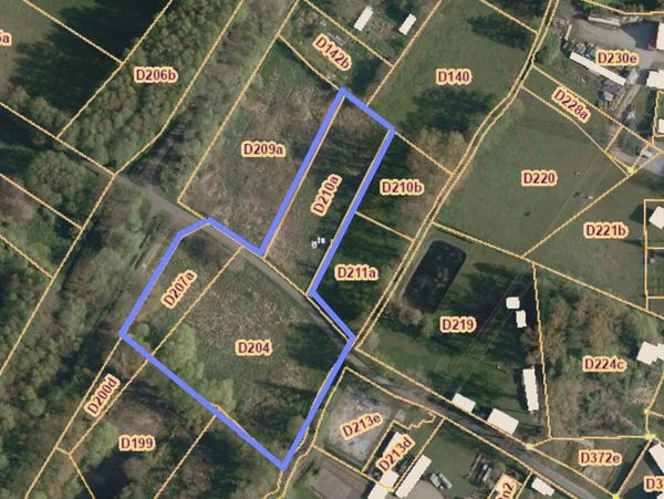 Aerial map showing land plots with boundaries and labels.
