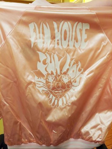 The back of a Champagne Pink Fun House Satin Jacket