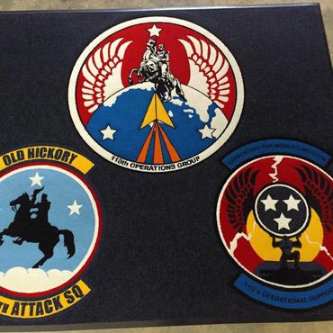 Three embroidered military patches with horsemen and stars.