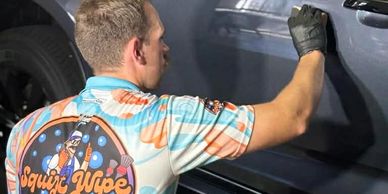 SQUIRT WIPE & GO DETAILER APPLYING CERAMIC COATING TO VEHICLE PAINTWORK AT THE ANGLE VALE DETAILING 