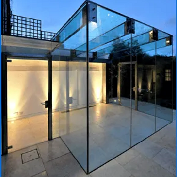 Modern glass enclosure with sleek lighting and tiled floor.