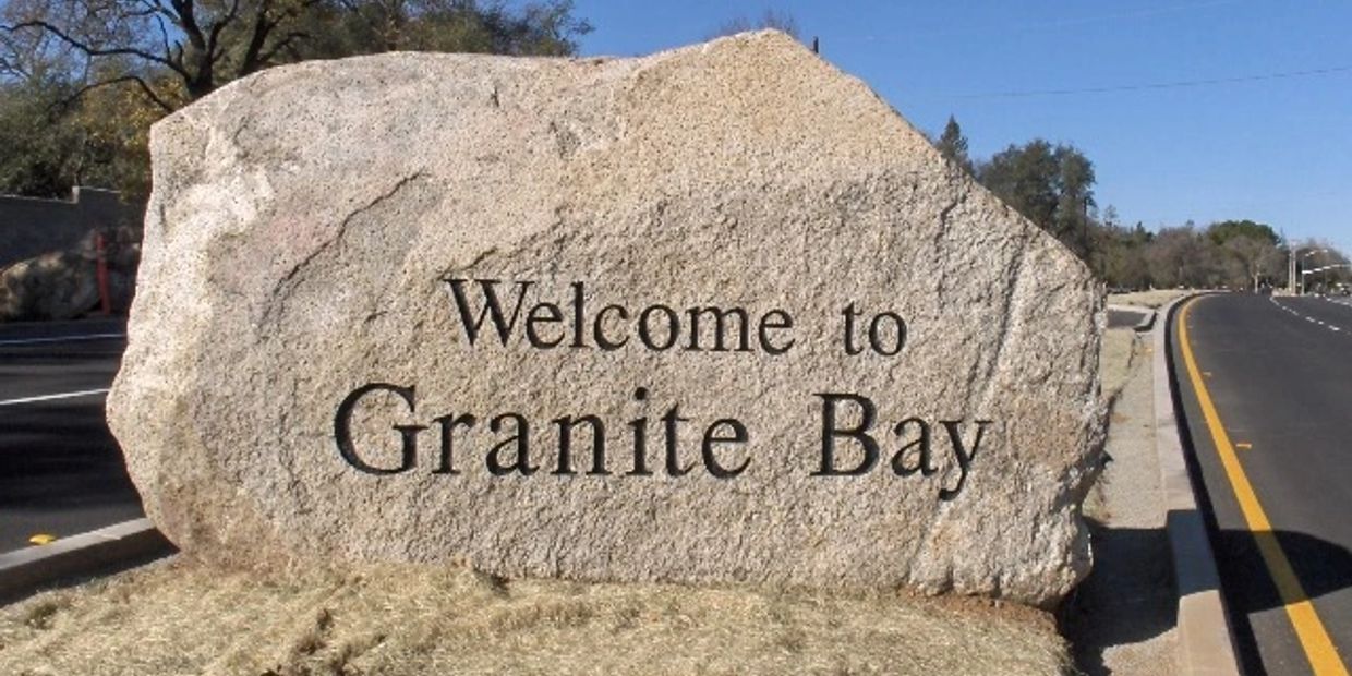 Large granite rock welcomes visitors to Granite Bay.