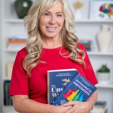 Woman in red holding two psychology books about narcissism.