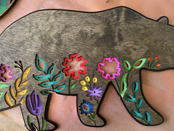 Wooden bear inlaid with painted flowers