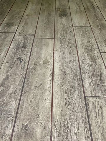 Close-up of textured wooden floorboards.