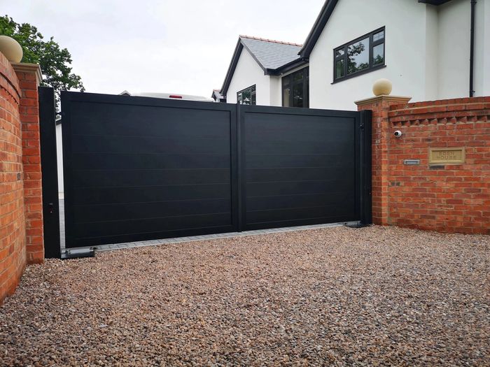 Electric gate installed in Mollington Chester. Made from Aluminium and using underground gate motors