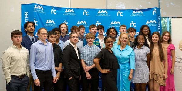 Picture of Joshua Price and the rest of the 2023 Madison CEO group at a UAH meeting.