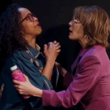 Two women engaging in an emotional conversation.