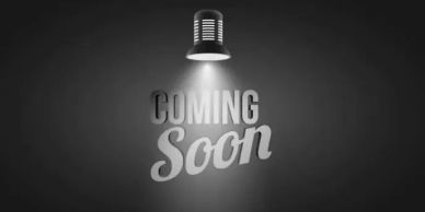 A spotlight shining on the words 'Coming Soon' in grayscale.