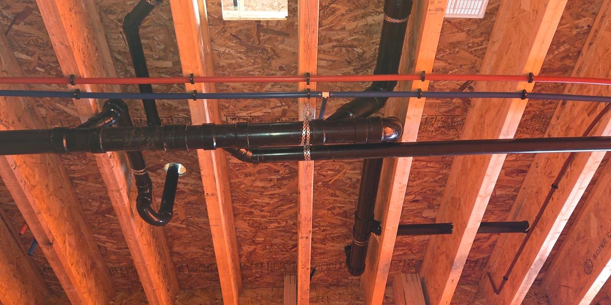 A plumbing rough-in done by Hydra plumbing with drainage, venting and water lines in Ottawa.