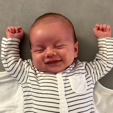 Baby smiling in his sleep