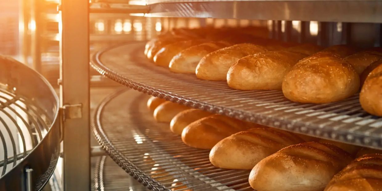 Freshly baked bread cooling on racks.