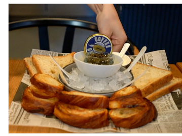 Serving caviar with bread and ice.