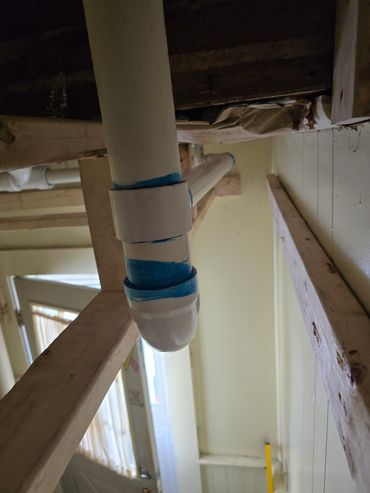 Box in plumbing from new renovation upstairs. P trap for corner shower