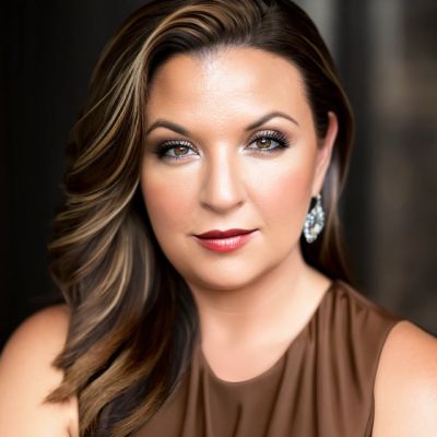 Confident woman with styled hair and earrings.