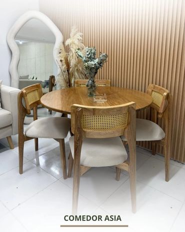 Elegant wooden dining set with rattan chairs and a decorative mirror.