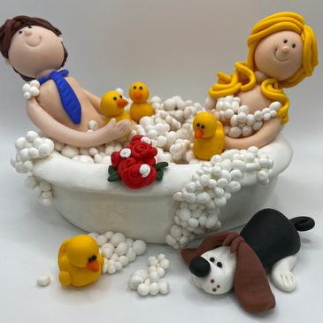 A unique wedding cake topper based on a couple in a bath with a dog and duck
A personalized keepsake