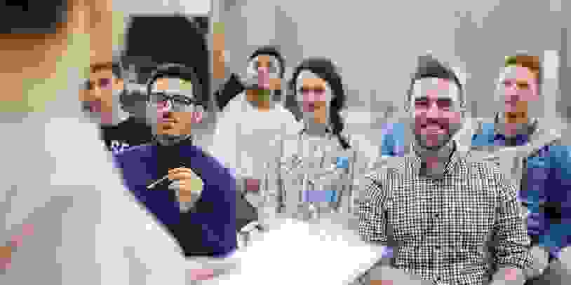 Groupmates listening to lecturer or speaker at conference
