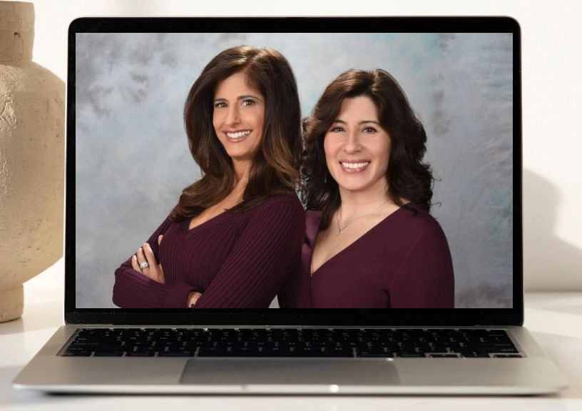 Computer laptop with image of professional organizers Annmarie Brogan and Marie Limpert.