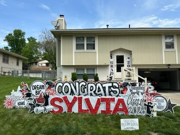 Yard sign congratulating Sylvia on her graduation.