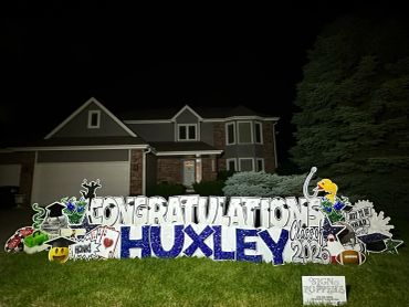 Yard sign congratulating Huxley on their 2026 graduation.