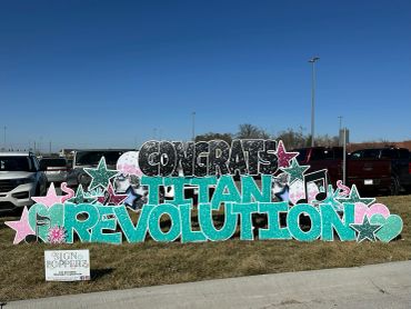 Colorful sign celebrating a Titan Revolution.
