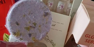 Variety of beauty and self-care products including bath bombs and false nails.