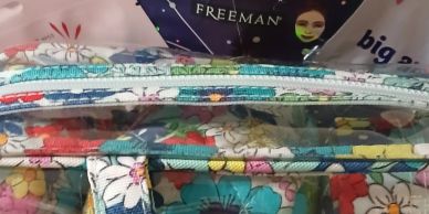 Colorful floral fabric with zipper.