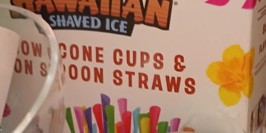 Hawaiian shaved ice colorful straws and cones packaging.