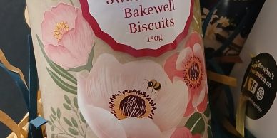 Package of Grandma Wild's Sweet Cherry Bakewell Biscuits with floral design.