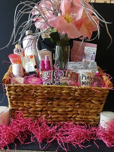 Gift basket with flowers and beauty products.