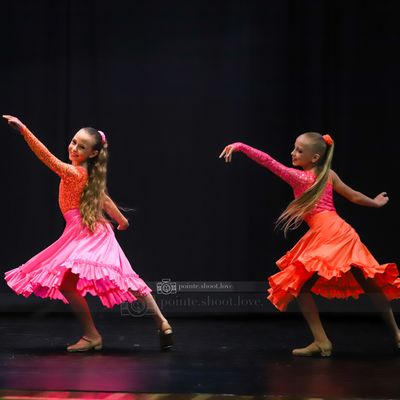 2 young girls tap dance at a dance competition