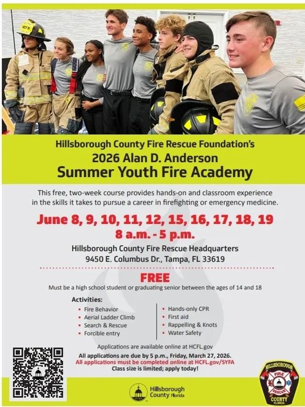 Group of youth firefighters posing together at a summer fire academy event.